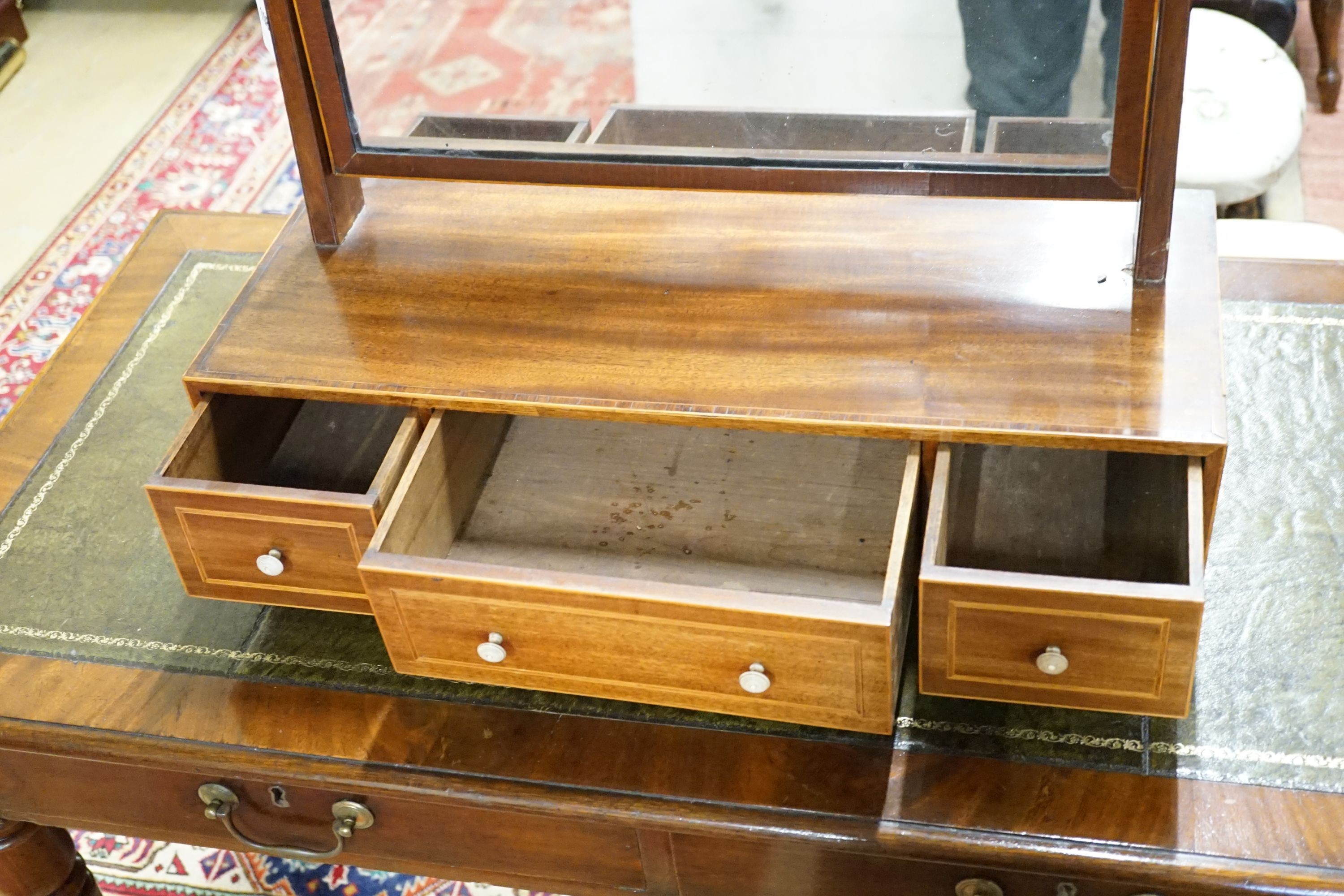 A Regency boxwood strung mahogany toilet mirror, width 62cm